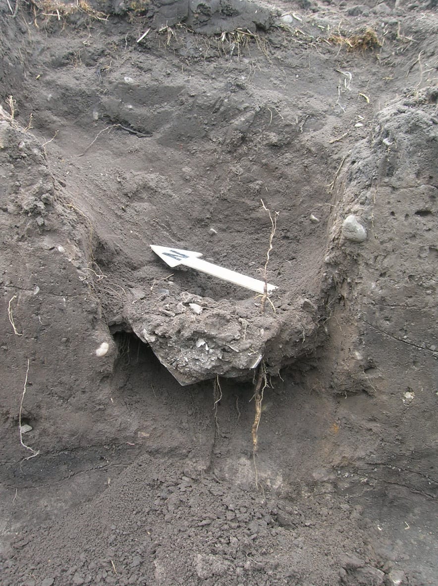 Cremation urn in Trench 2 under excavation